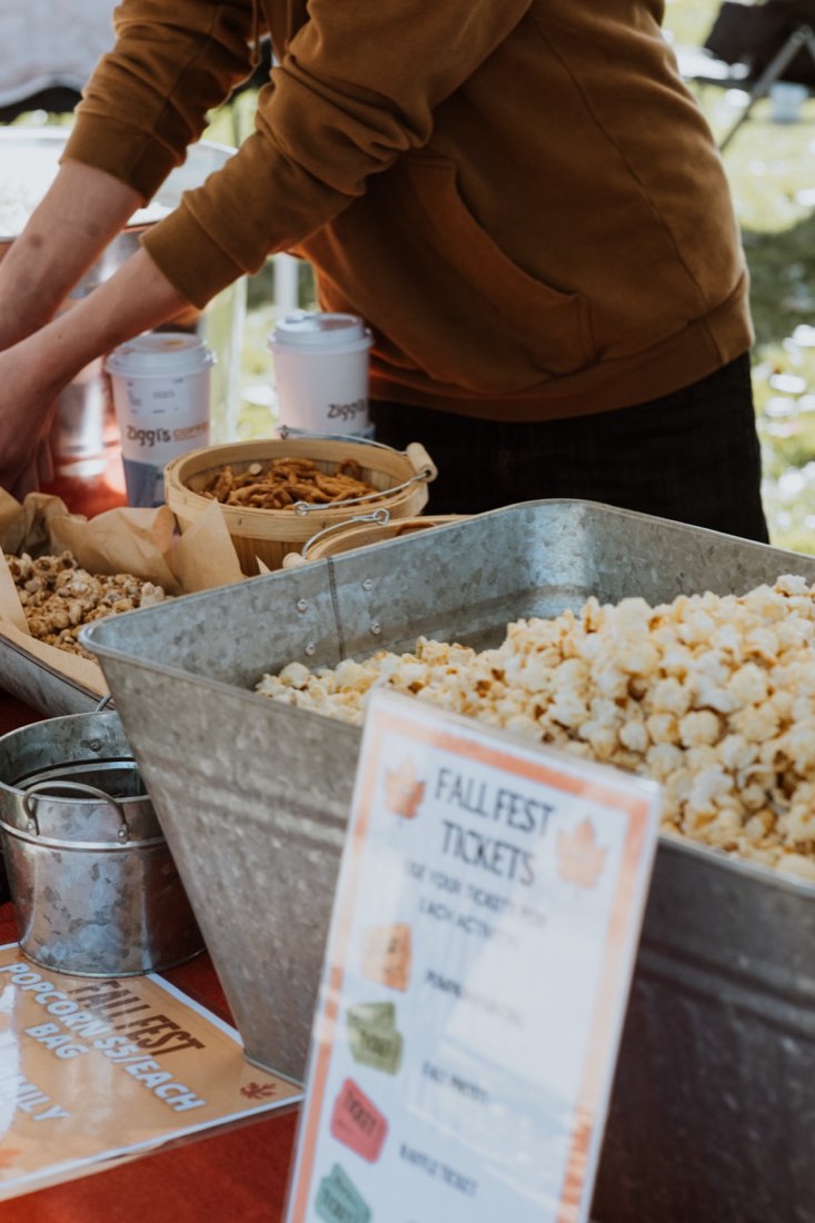 Scooping popcorn at the Fall Fest popcorn bar